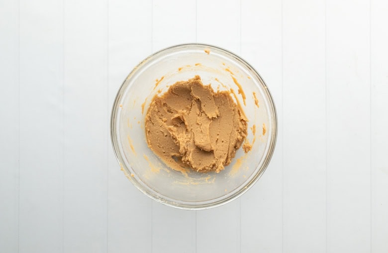 clear bowl with wet ingredients for healthy gingerbread cookies