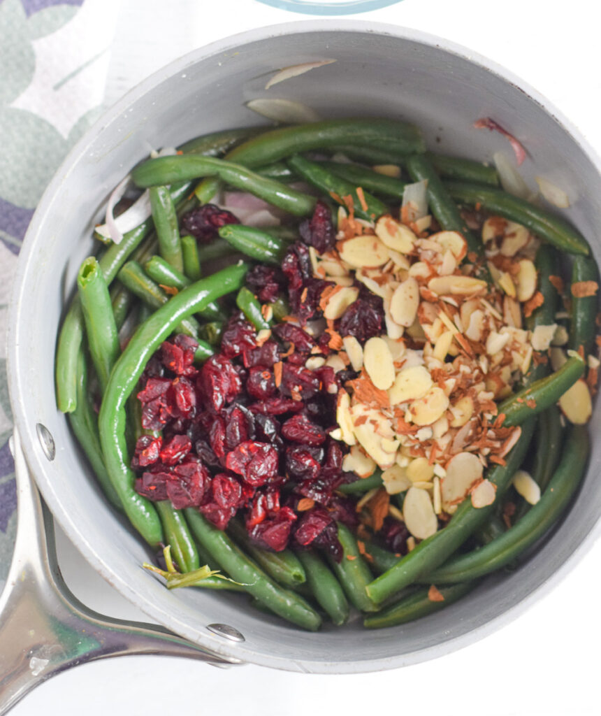 cranberry almond green beans in cooking pot