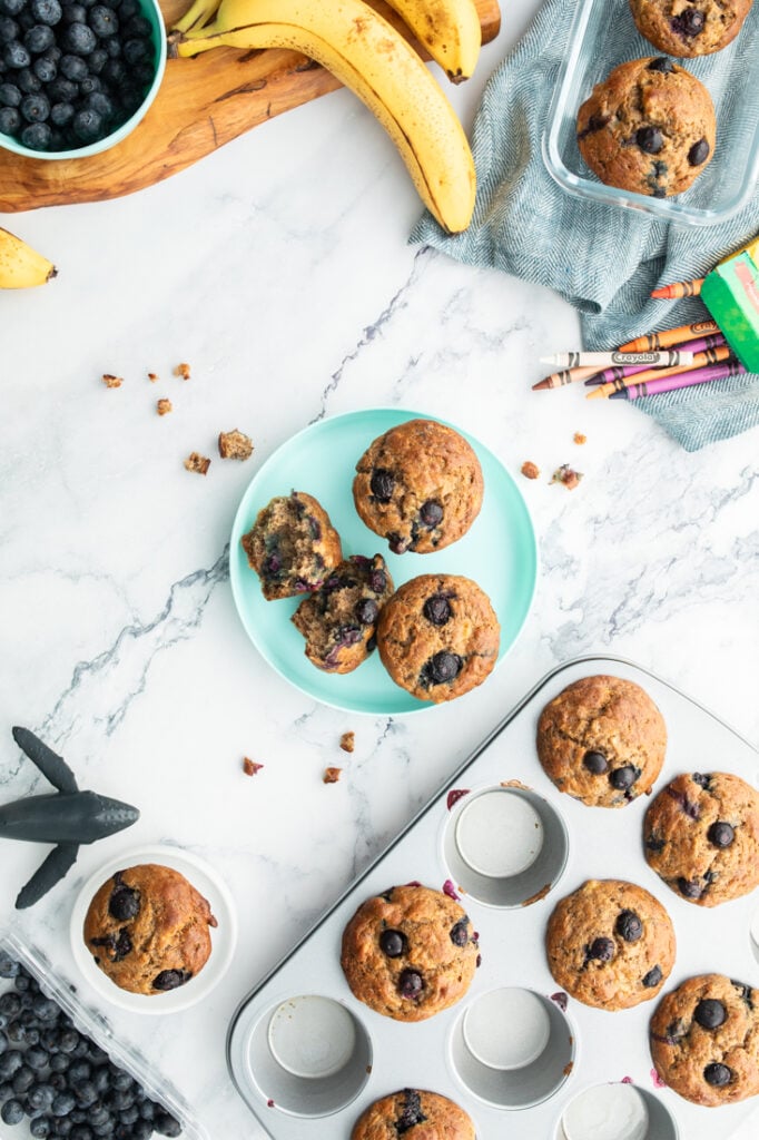 blueberry banana muffins on blue plate