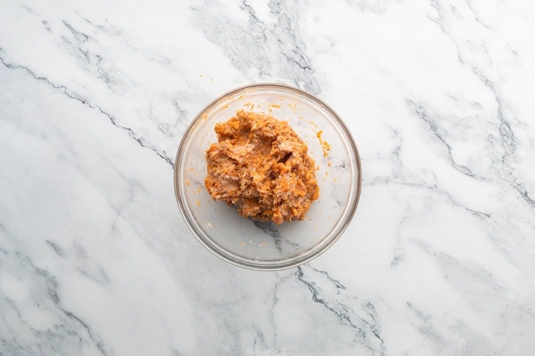 Combined ingredients in a bowl for sweetpotato nuggets.