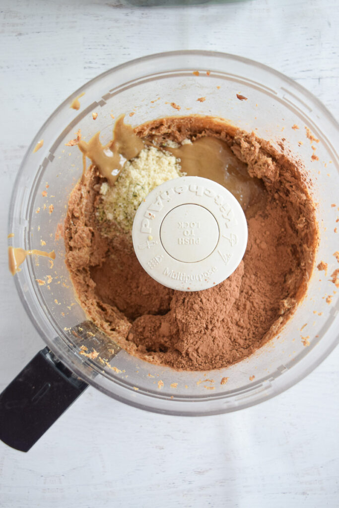 food processor with dates, hemp seeds, almond flour and sunflower butter