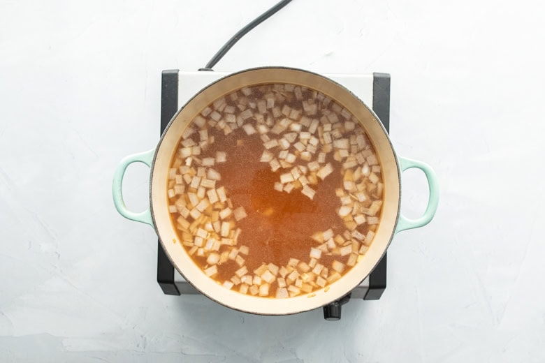 veggie barley soup being brought to a boil