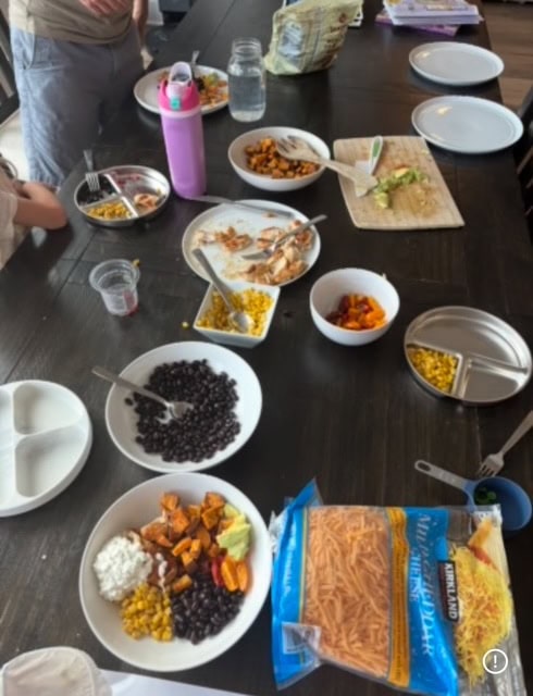 family style meal on dinner table with separate plates for ingredients