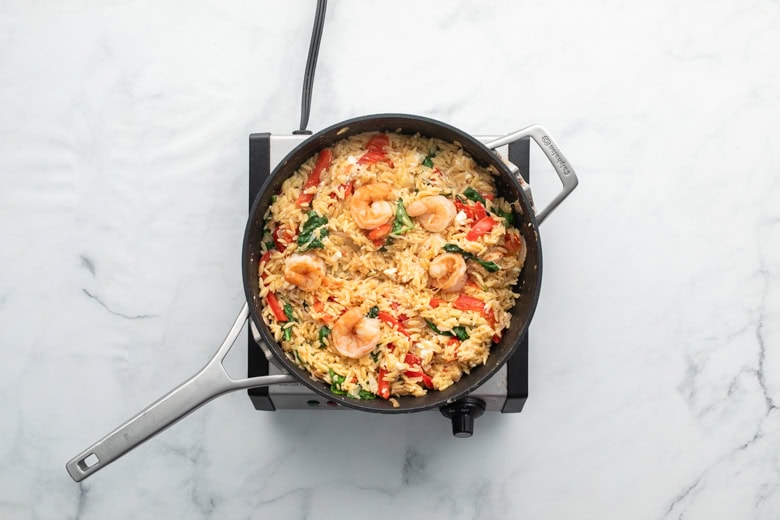 lemon orzo with shrimp and veggies in cooking skillet