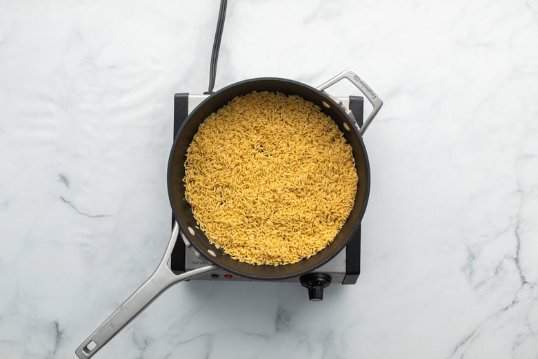 toasted orzo in cooking skillet