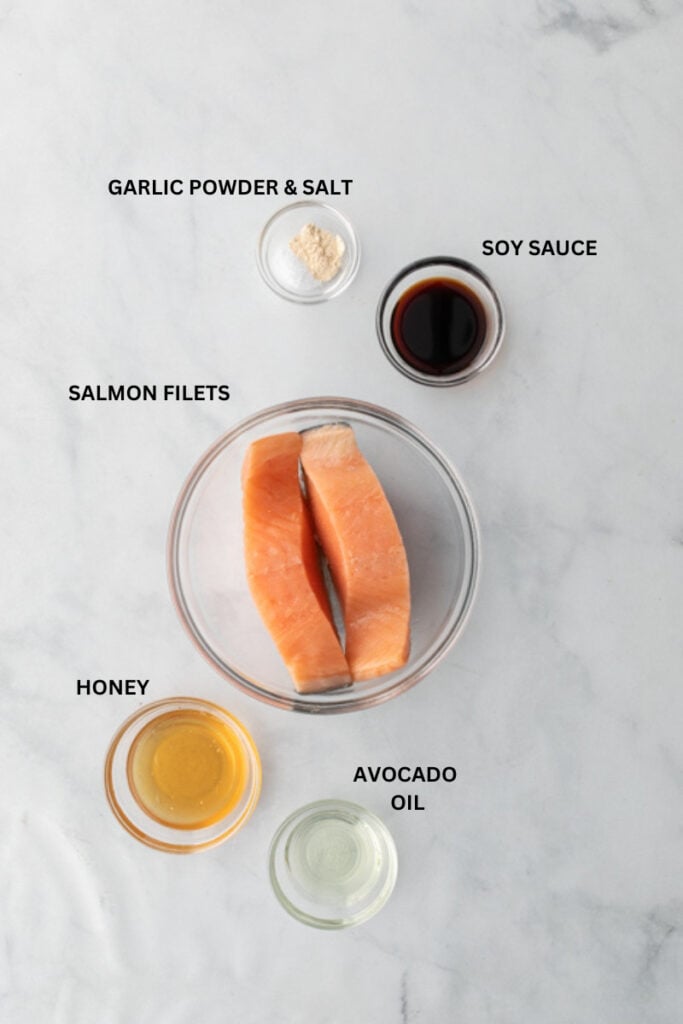 salmon filets in clear bowls with other ingredients for air fried salmon bites