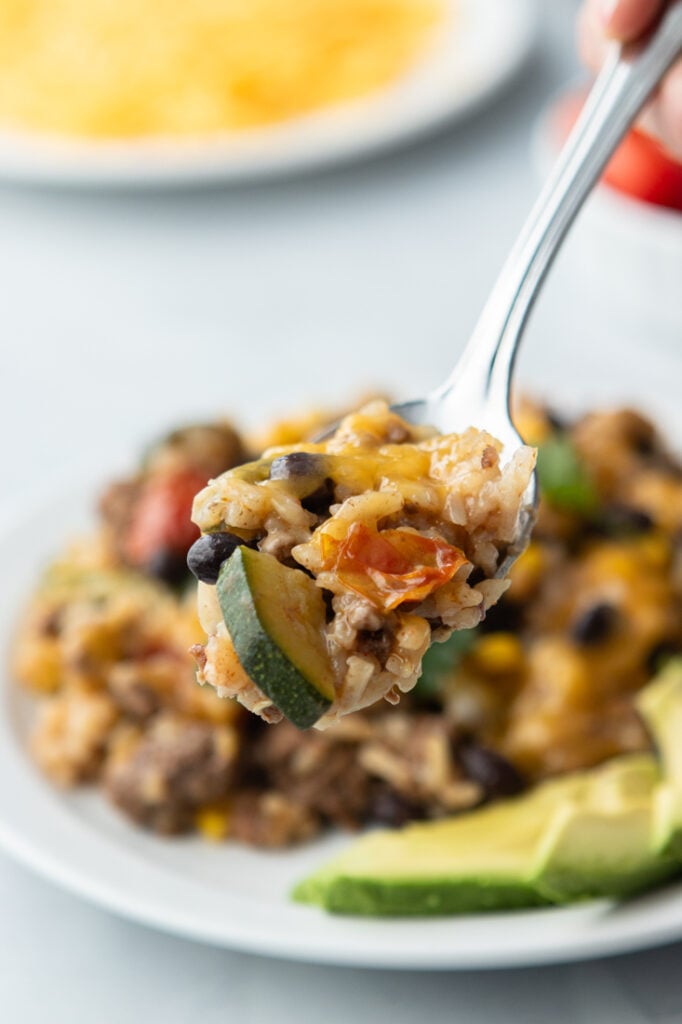 bite of ground beef and rice skillet on fork