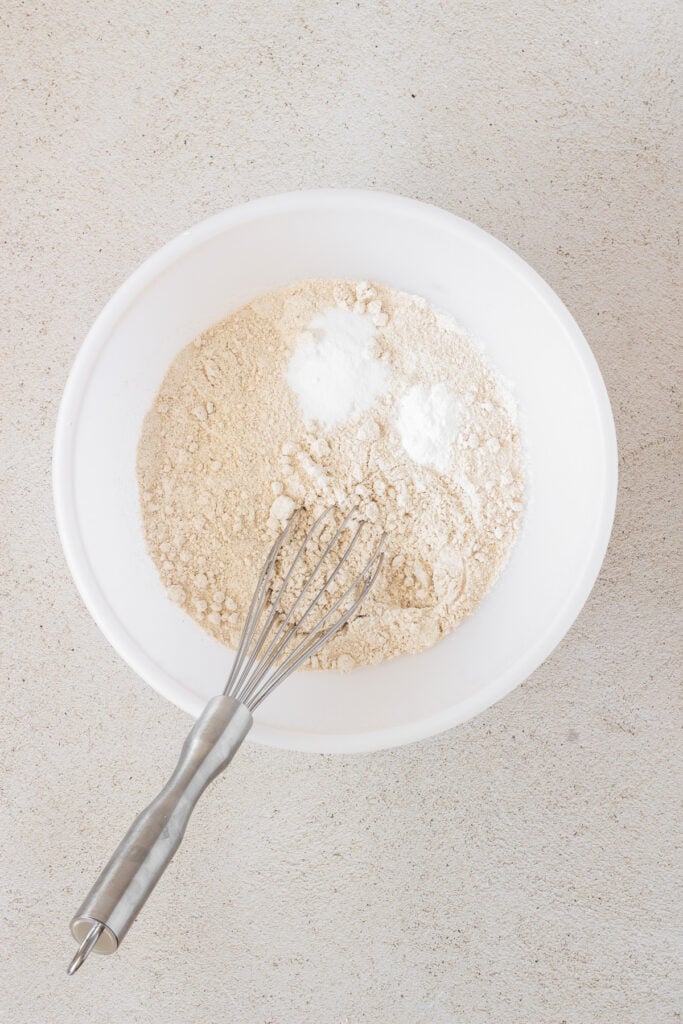 dry ingredients in white bowl for spinach muffins