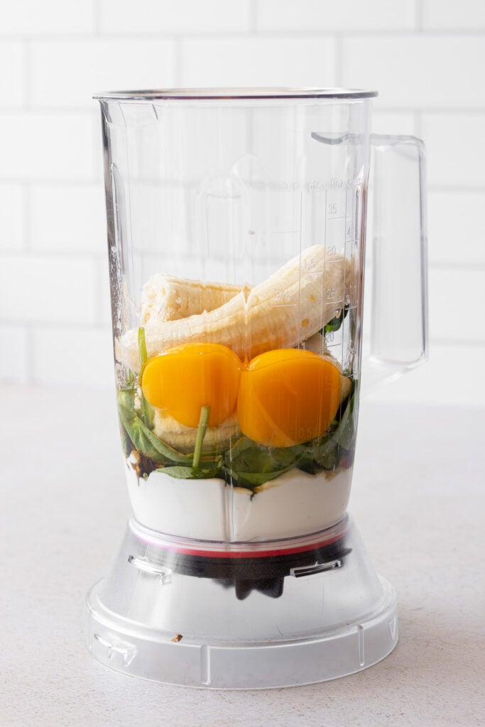 blender with ingredients for spinach muffins