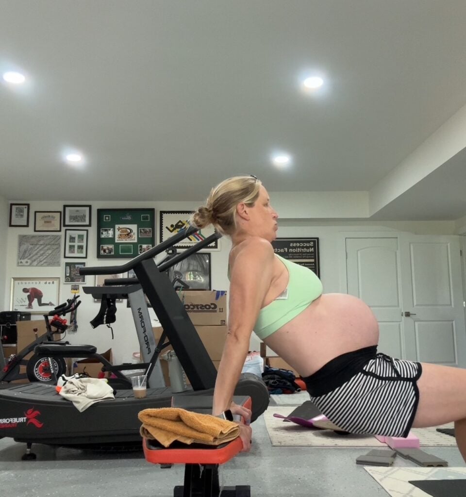 Woman exercising on bench at 35 weeks pregnant