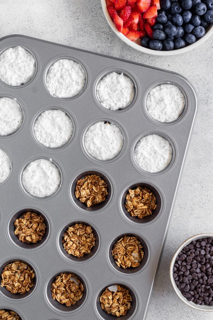 Layered frozen yogurt bites with granola and yogurt.