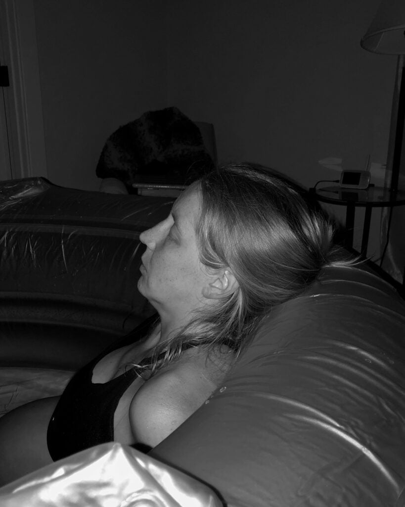 woman laboring in a birth tub