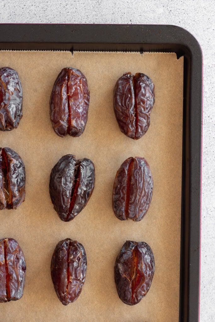 dates sliced on baking sheet
