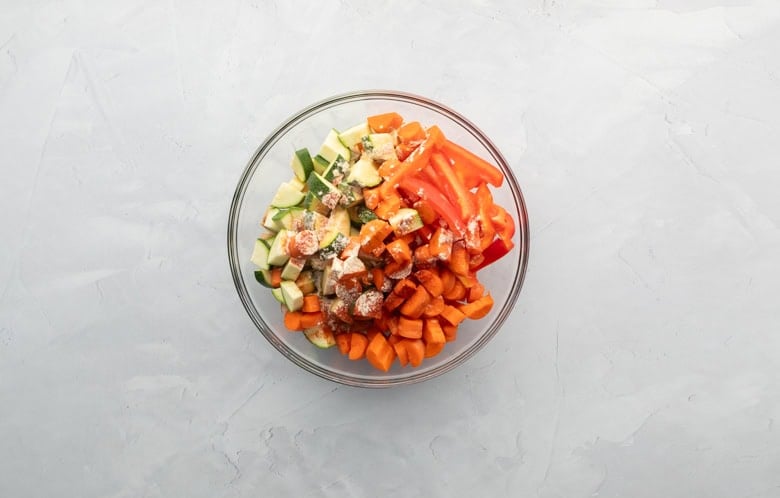 Combined veggies and seasonings for sheet pan kielbasa recipe