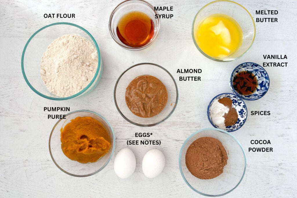 Glass bowls with ingredients for brownies with pumpkin and chocolate.