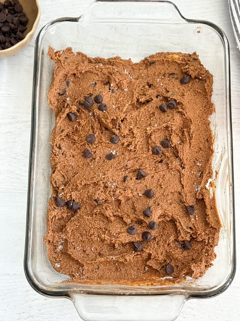 pumpkin chocolate brownie batter in clear baking dish.